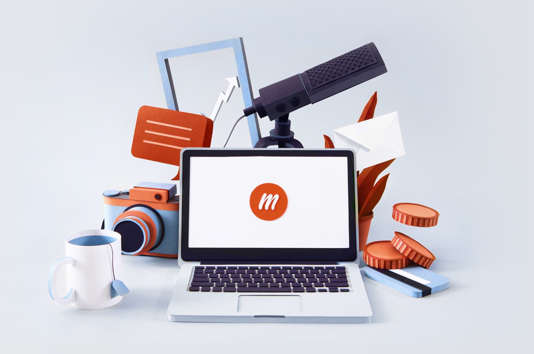 Paper illustrations of a laptop with a memberful logo surrounded by a teacup, camera, microphone, and more.