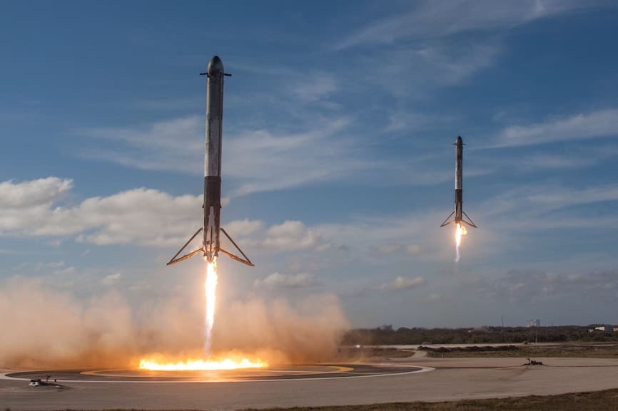 Two rockets launching into space