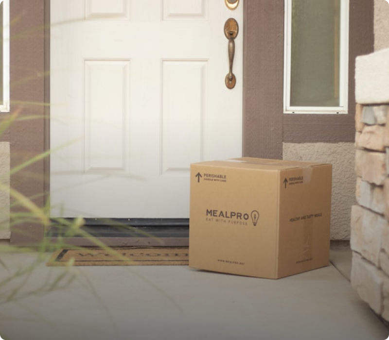 Package sitting next to front door entrance